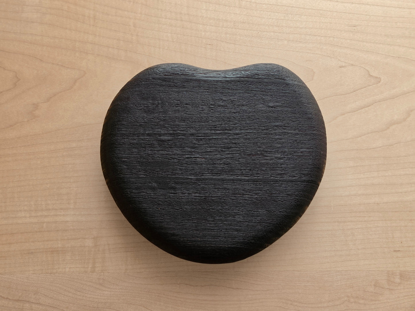 Scorched Jarrah heart-shaped pebble paperweight by Nathan Day Design, handcrafted timber desk ornament