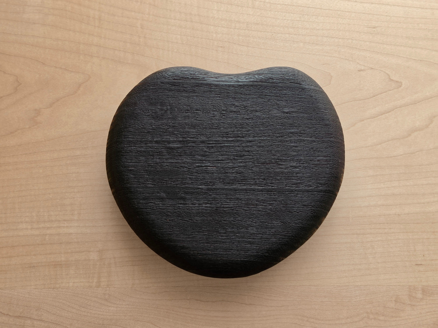 Scorched Jarrah heart-shaped pebble paperweight by Nathan Day Design, handcrafted timber desk ornament