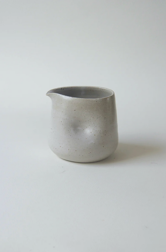 Handmade stoneware gravy pourer with dimpled grip by Kura Studio, Australian ceramics