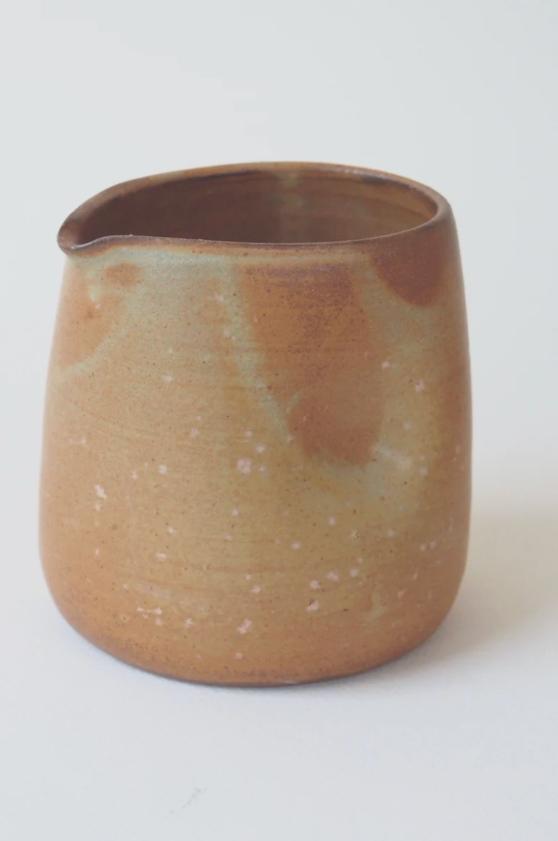 Handmade stoneware gravy pourer with dimpled grip by Kura Studio, Australian ceramics – detail