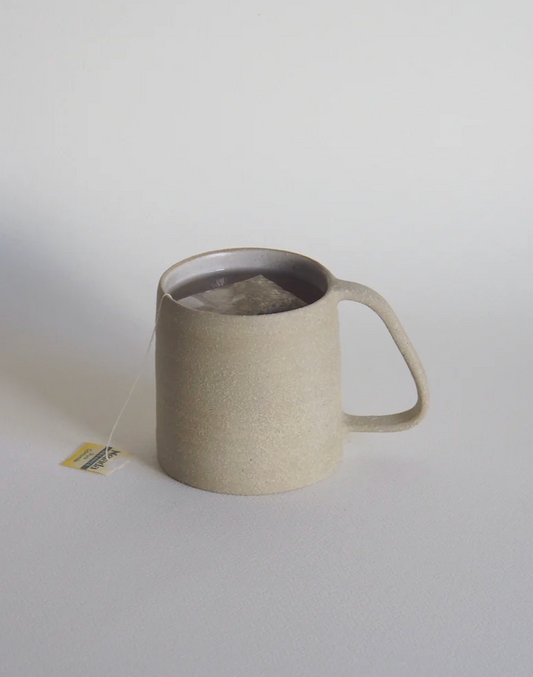Morrie Mug handmade stoneware mug with raw clay exterior by Kura Studio